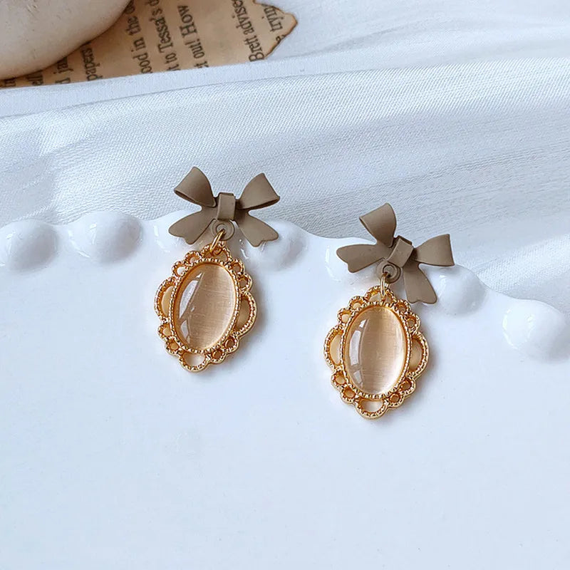 Golden Bowknot Heart Resin Earrings